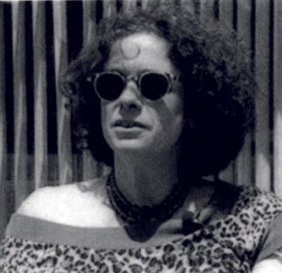 A photo of Simi Linton wearing sunglasses and a leopard print top.